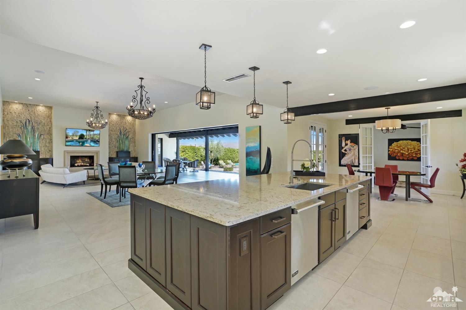 40757 Thunderbird Road Rancho Mirage, CA 92270 - Photo 30 of 70 an open kitchen with a sink and living area view