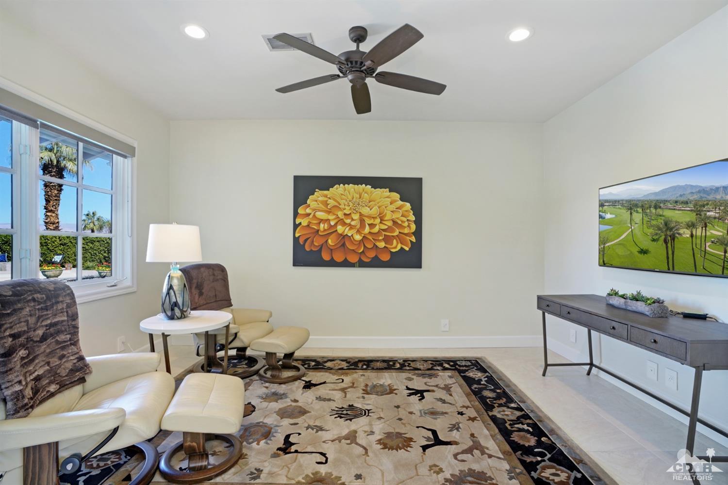 40757 Thunderbird Road Rancho Mirage, CA 92270 - Photo 35 of 70 a living room with furniture and a flat screen tv