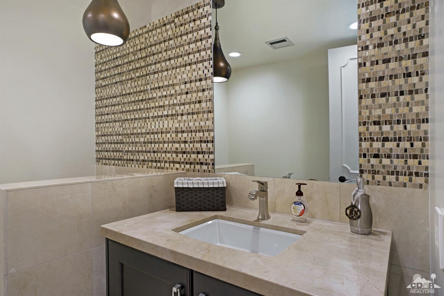 40757 Thunderbird Road Rancho Mirage, CA 92270 - Photo 36 of 70 a bathroom with a sink and a vanity