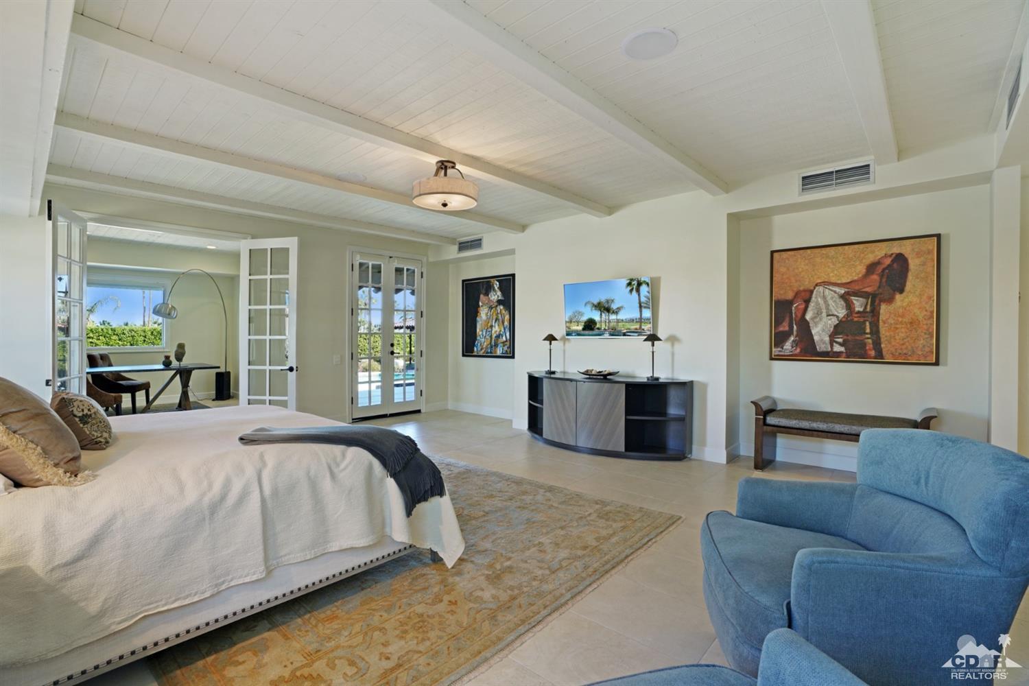 40757 Thunderbird Road Rancho Mirage, CA 92270 - Photo 38 of 70 a bedroom with a large bed couch and a window