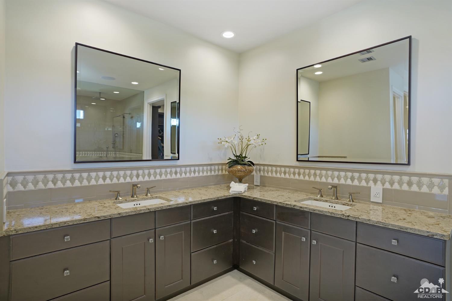 40757 Thunderbird Road Rancho Mirage, CA 92270 - Photo 40 of 70 a bathroom with double vanity and a mirror