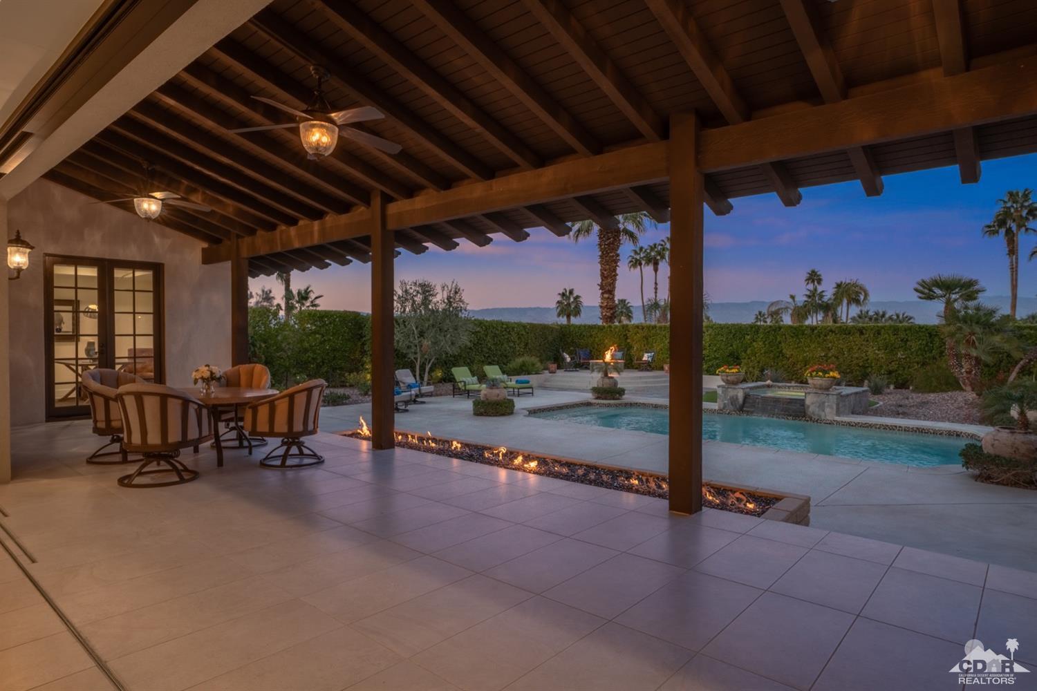 40757 Thunderbird Road Rancho Mirage, CA 92270 - Photo 5 of 70 a view of a porch with furniture and a yard