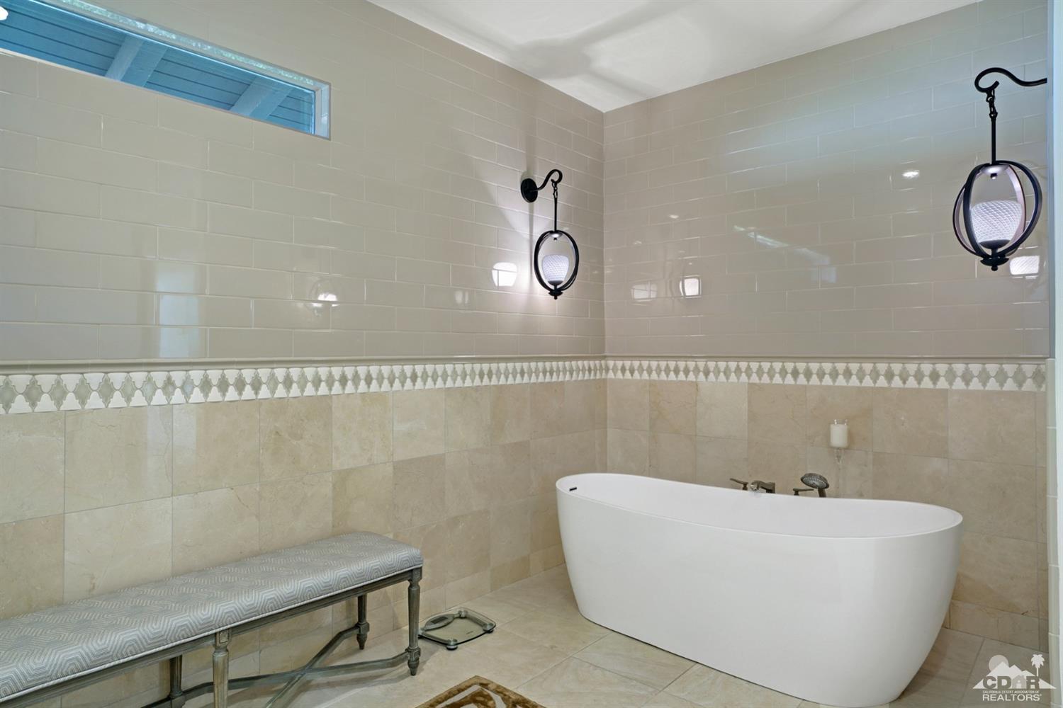 40757 Thunderbird Road Rancho Mirage, CA 92270 - Photo 42 of 70 a bathroom with a bathtub and shower
