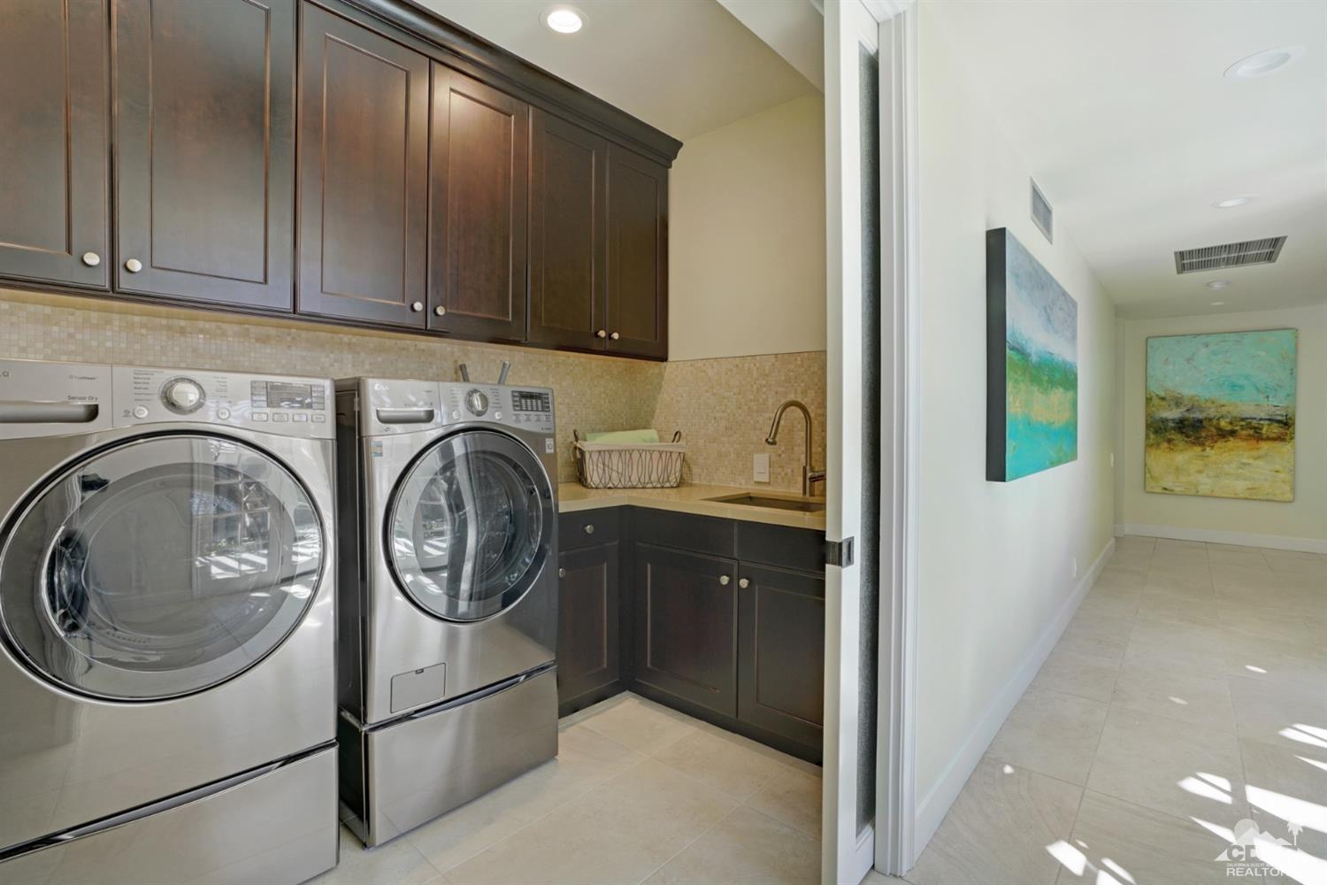 40757 Thunderbird Road Rancho Mirage, CA 92270 - Photo 46 of 70 a utility room with dryer and washer