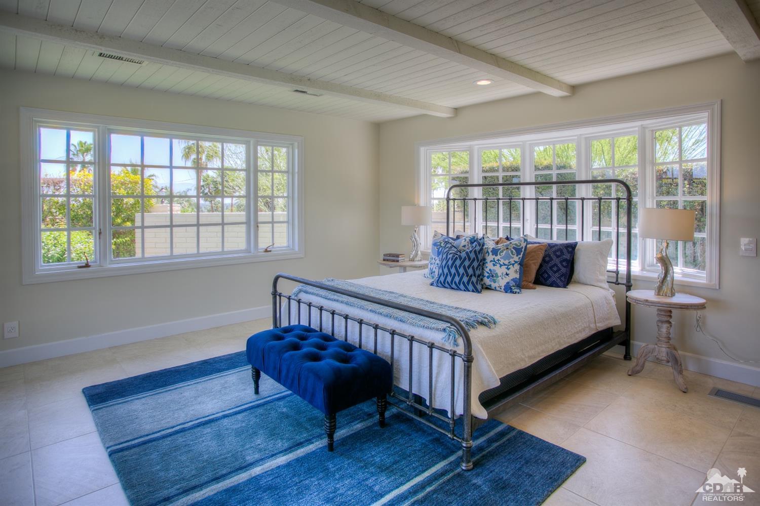 40757 Thunderbird Road Rancho Mirage, CA 92270 - Photo 48 of 70 a bed sitting in a bedroom next to a window
