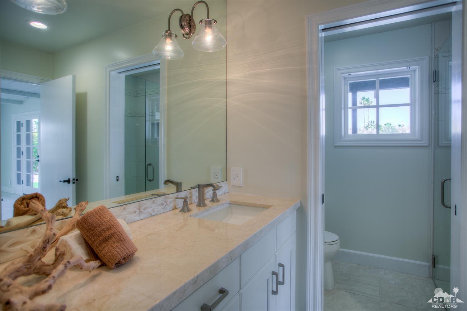 40757 Thunderbird Road Rancho Mirage, CA 92270 - Photo 49 of 70 a bathroom with a sink double vanity and shower