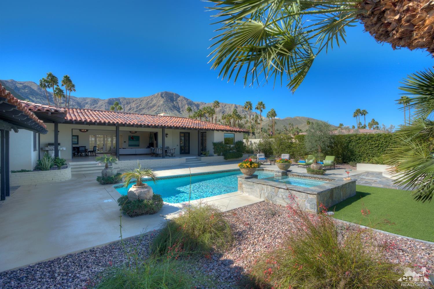 40757 Thunderbird Road Rancho Mirage, CA 92270 - Photo 54 of 70 a view of a house with swimming pool and a yard