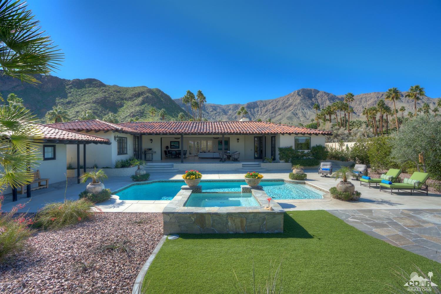 40757 Thunderbird Road Rancho Mirage, CA 92270 - Photo 55 of 70 a view of a house with swimming pool and a yard