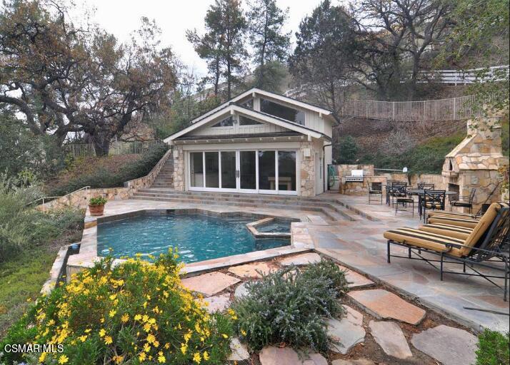 5537 Round Meadow Road Hidden Hills, CA 91302 - Photo 15 of 17 a front view of a house with garden