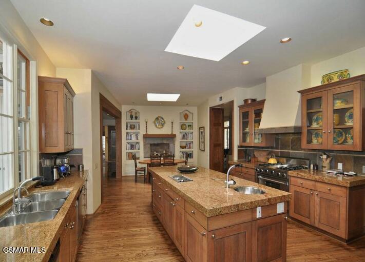 5537 Round Meadow Road Hidden Hills, CA 91302 - Photo 7 of 17 a kitchen with stainless steel appliances granite countertop a stove and a sink
