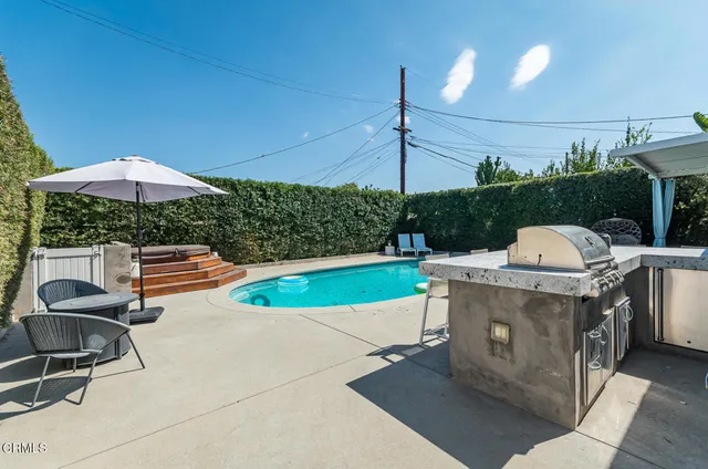 a patio with table and chairs