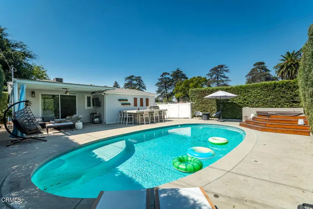 a room with furniture and a flat screen tv