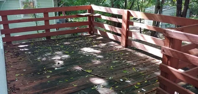 a view of a small yard with wooden fence