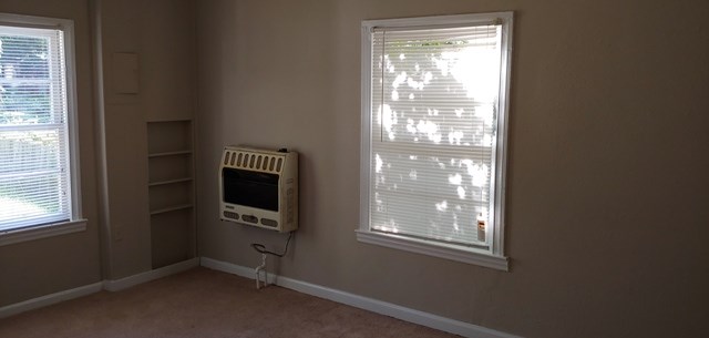 918 Dozier Street Columbus, GA 31904 - Photo 4 of 12 a room with window and a flat screen tv