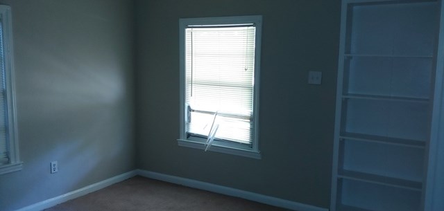 918 Dozier Street Columbus, GA 31904 - Photo 5 of 12 a view of an empty room with a window