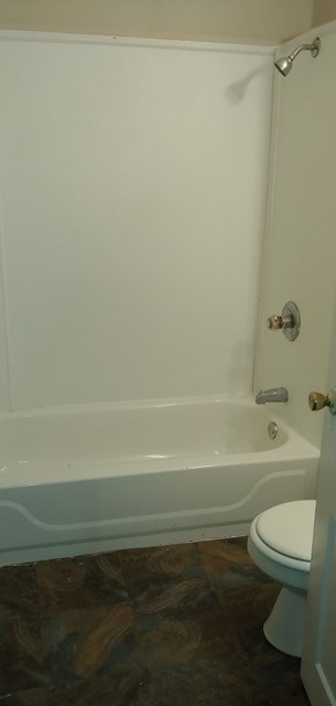 918 Dozier Street Columbus, GA 31904 - Photo 7 of 12 a bathroom with a toilet and a bath tub