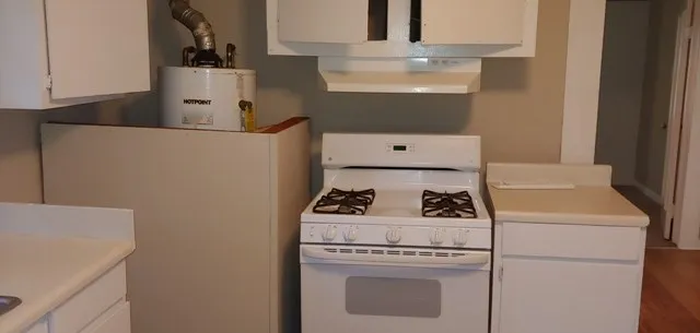 a close up of a utility room with washer and dryer