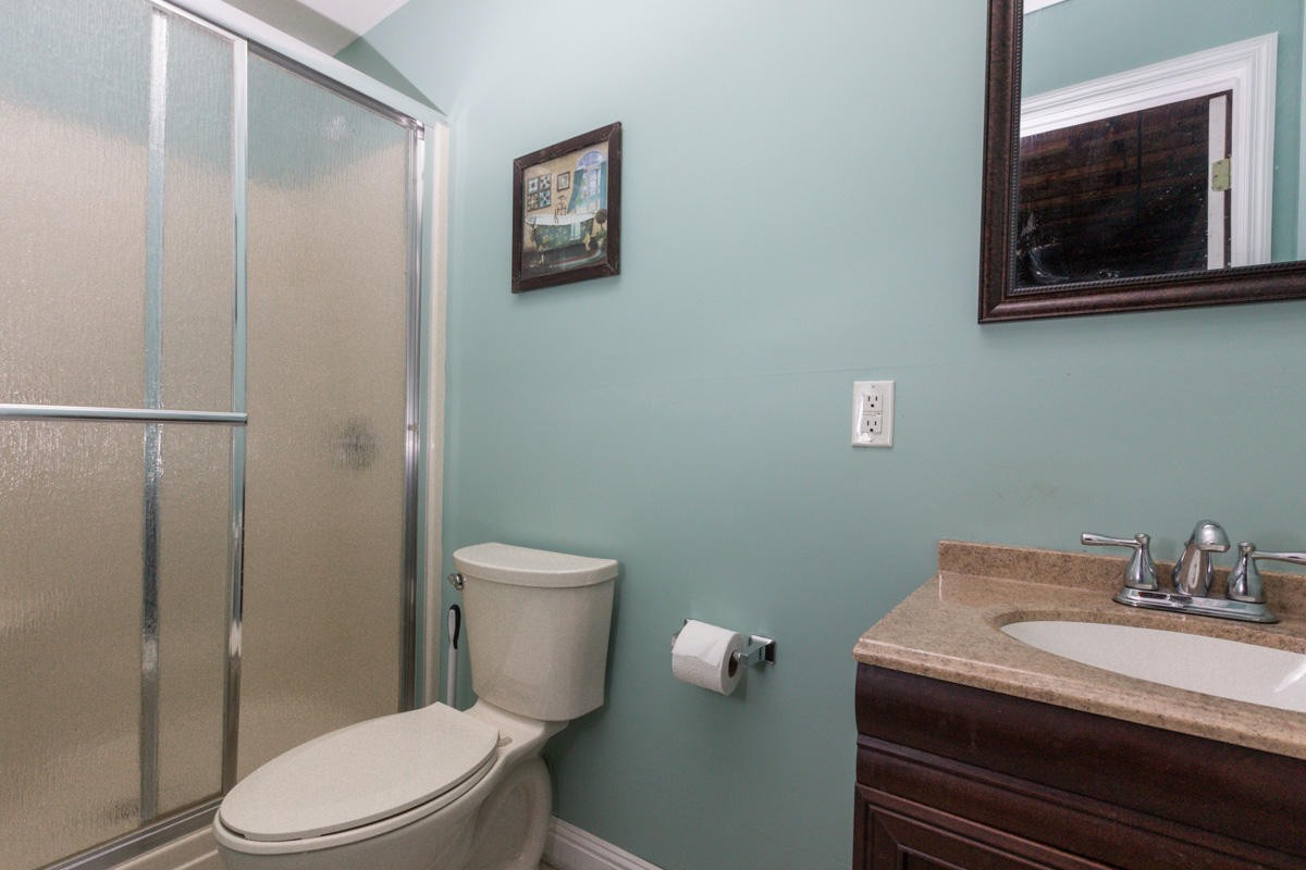 313 Gage Road Philadelphia, TN 37846 - Photo 17 of 21 a bathroom with a toilet a sink and shower