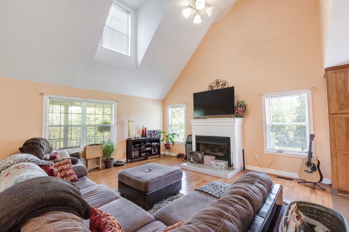 313 Gage Road Philadelphia, TN 37846 - Photo 6 of 21 a living room with furniture fireplace and a flat screen tv