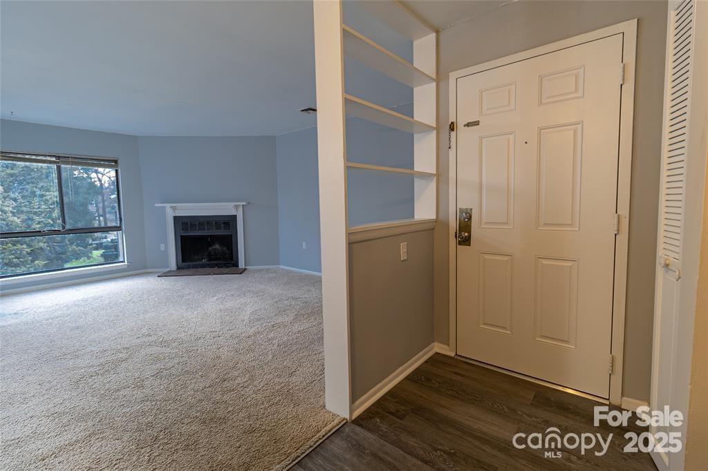 4814 Spring Lake Drive, Unit E Charlotte, NC 28212 - Photo 6 of 15 an empty room with windows and closet