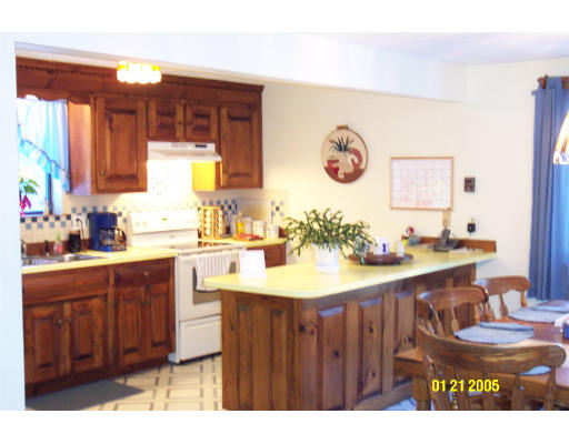136 Middle Road Boxborough, MA 01719 - Photo 3 of 12 a bathroom with a granite countertop sink a large mirror and vanity