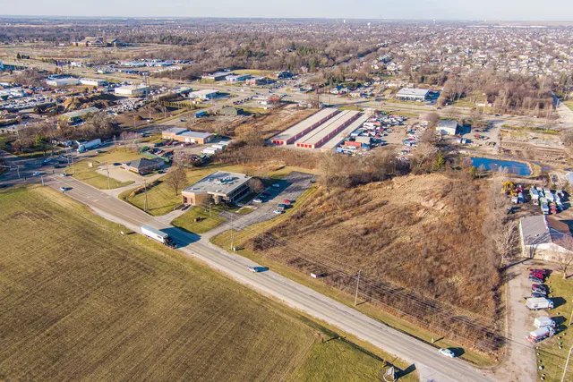 an aerial view of residential houses with outdoor space