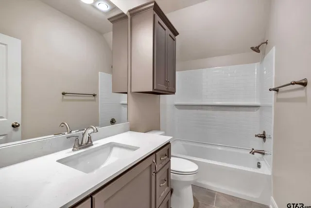 a bathroom with a sink a toilet and a bathtub