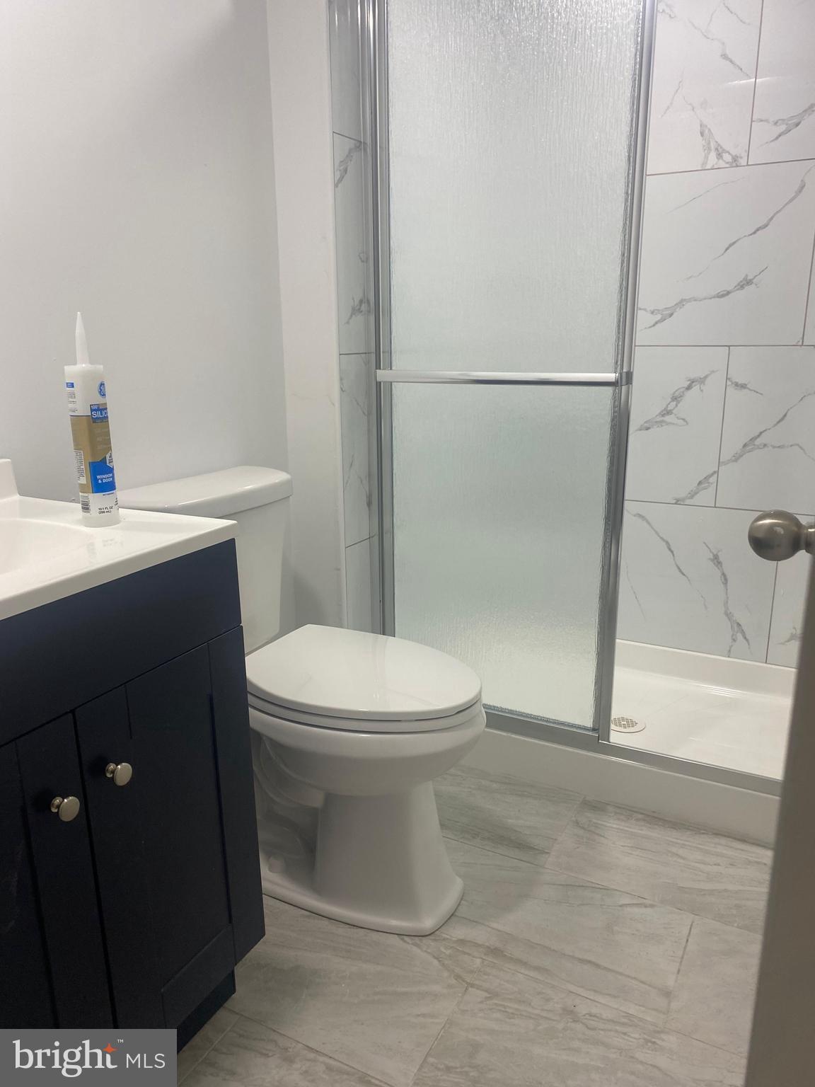 3324 Willits Road, Unit 16A Philadelphia, PA 19136 - Photo 5 of 5 a bathroom with a sink a toilet and shower