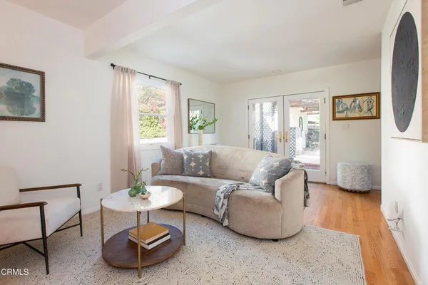 a living room with furniture and a table