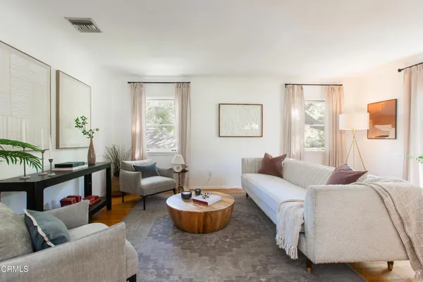 a living room with furniture and a large window