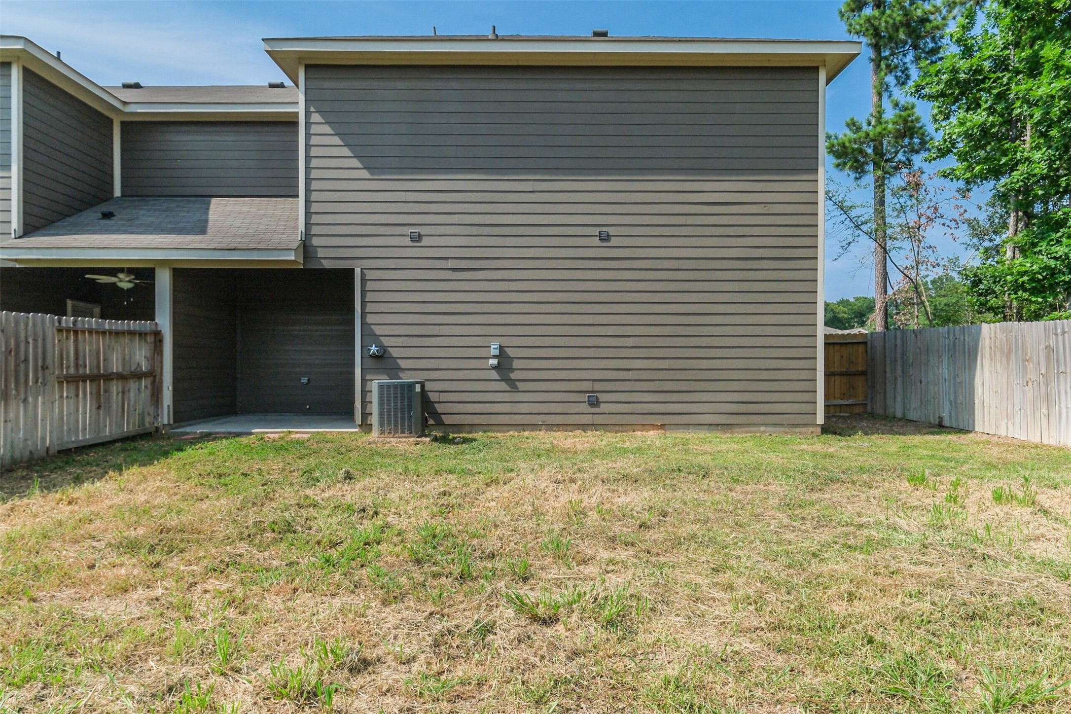 121 Wickersham, Unit A Conroe, TX 77304 - Photo 33 of 37 a backyard of a house
