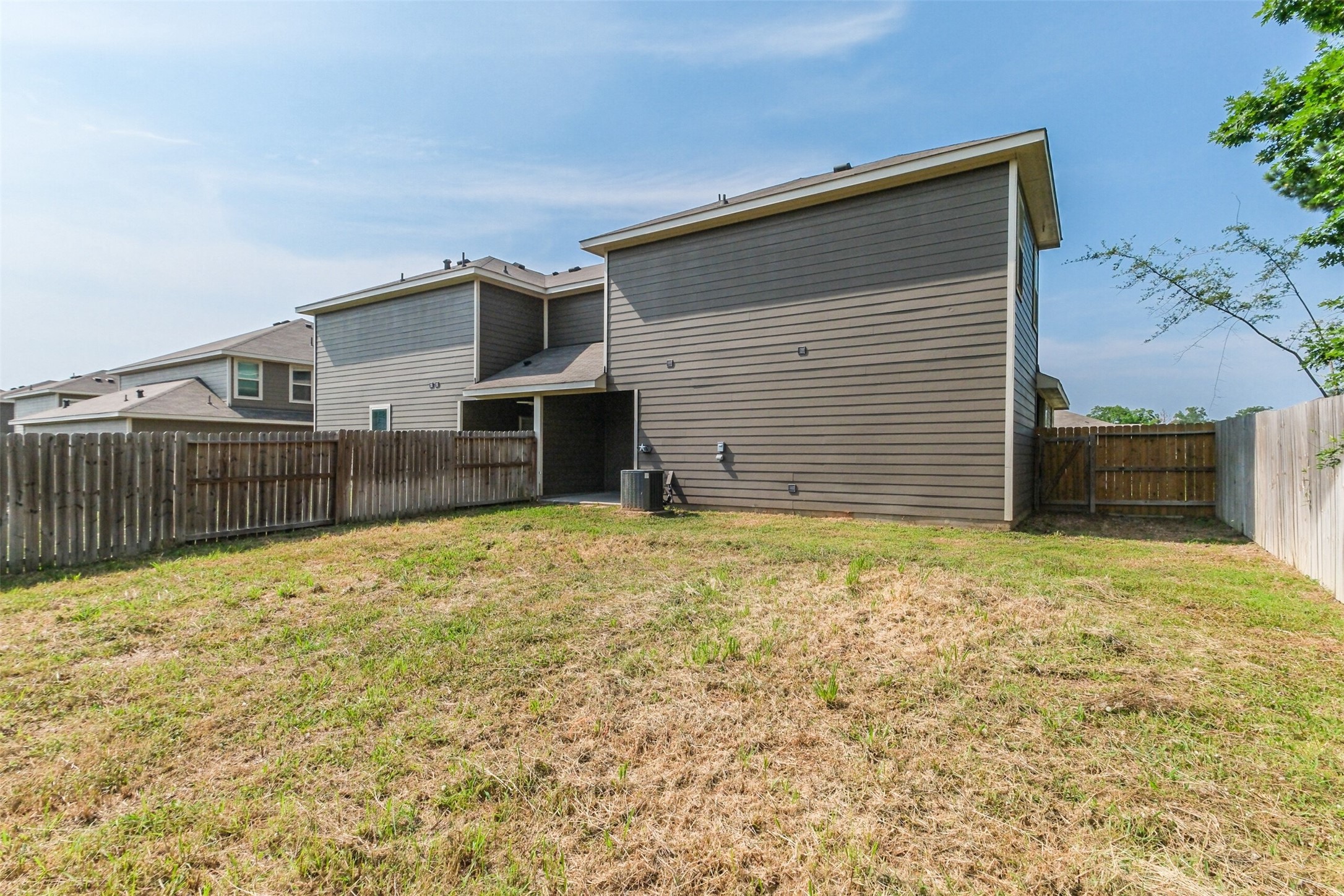 121 Wickersham, Unit A Conroe, TX 77304 - Photo 34 of 37 a view of a backyard