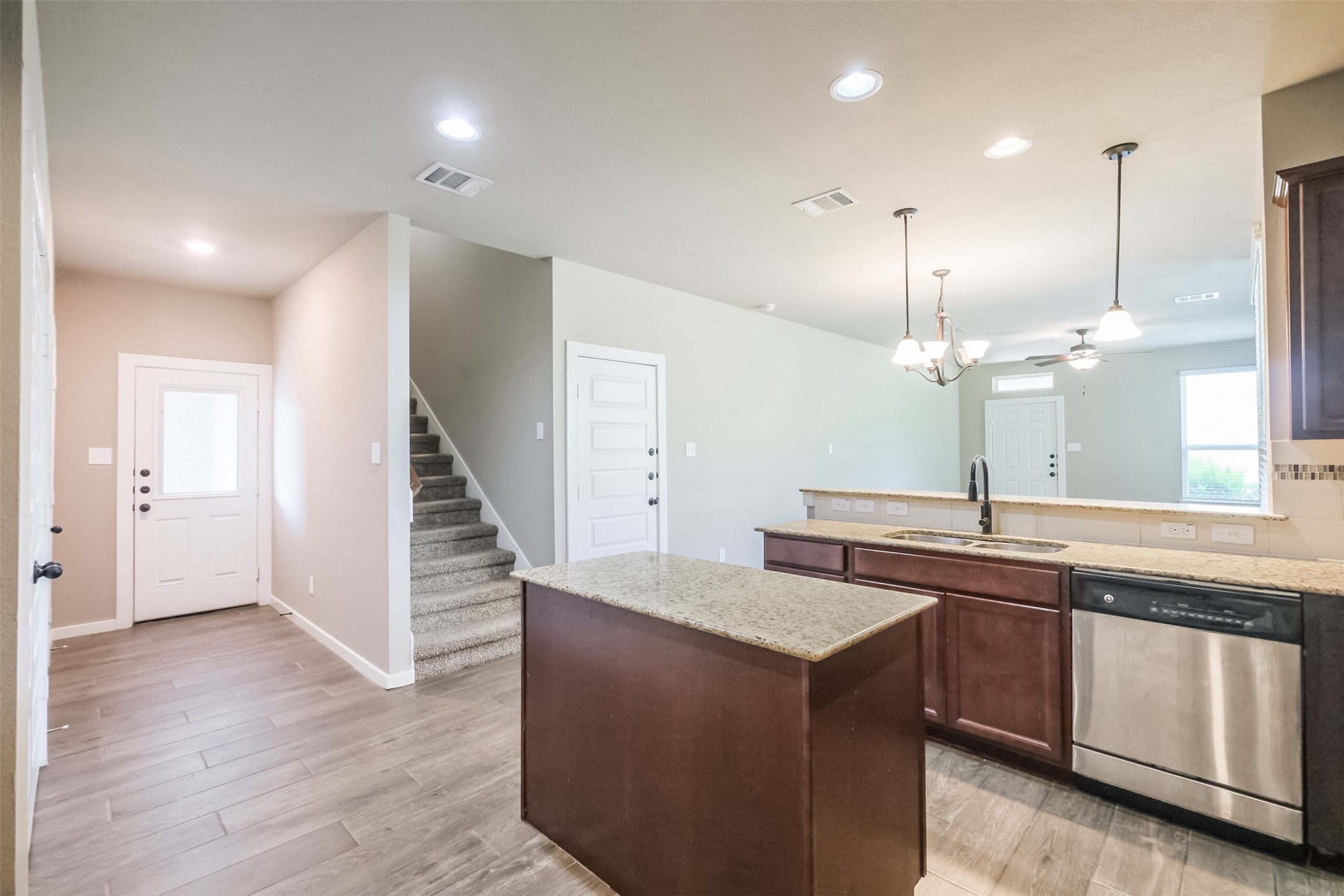 121 Wickersham, Unit A Conroe, TX 77304 - Photo 5 of 37 a kitchen with a sink and window