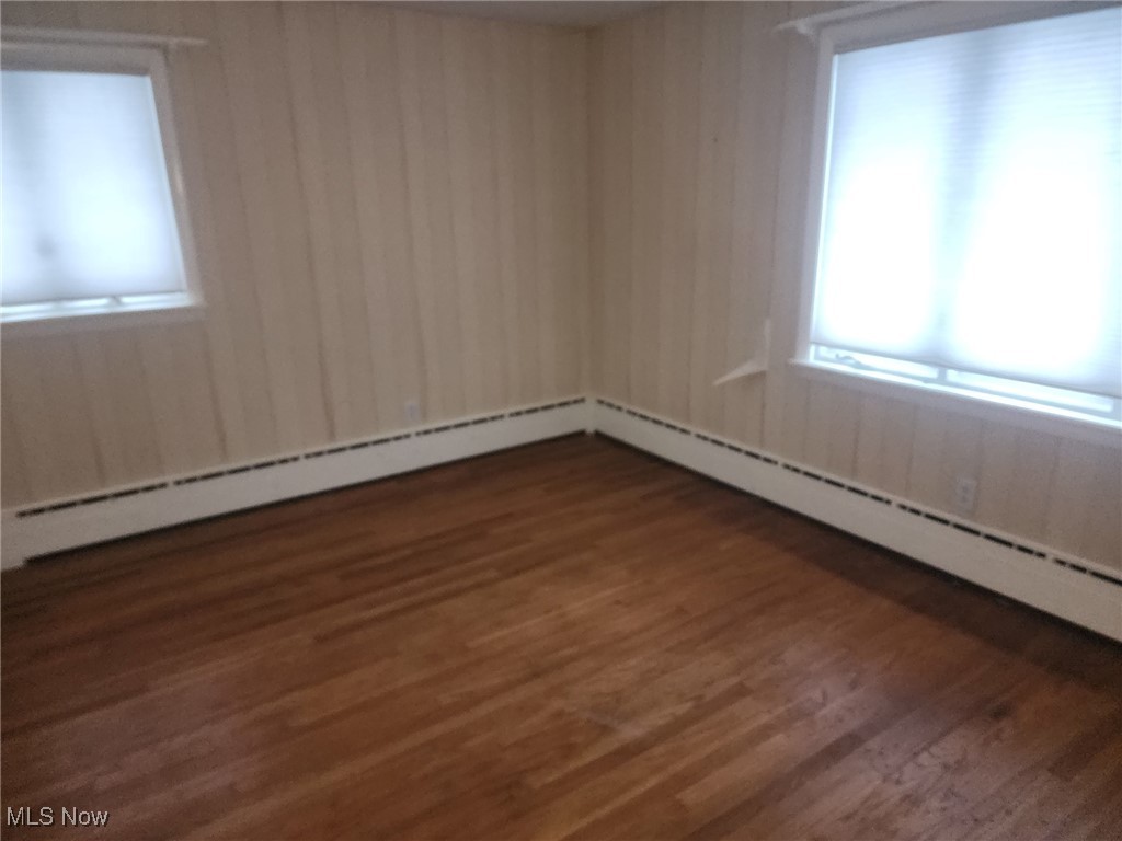 7516 Mayfield Road Chesterland, OH 44026 - Photo 10 of 21 Spare room featuring wood finished floors