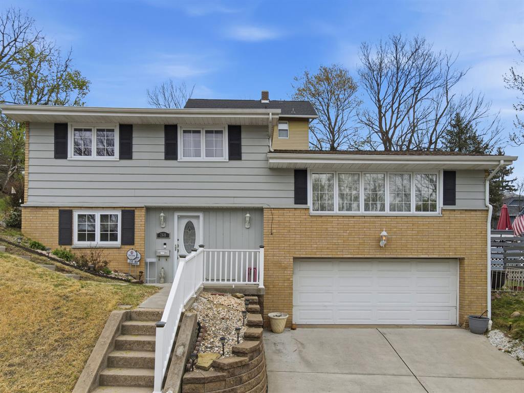 a front view of a house with stairs