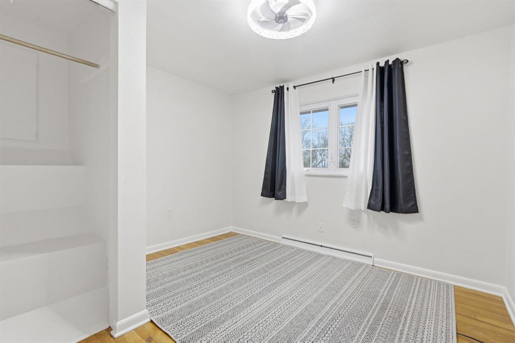 268 Plummer Avenue Pittsburgh, PA 15202 - Photo 22 of 50 a view of a room with wooden floor and brick wall