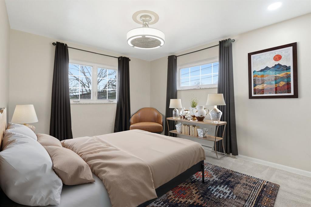 268 Plummer Avenue Pittsburgh, PA 15202 - Photo 26 of 50 a bedroom with a bed and wooden floor