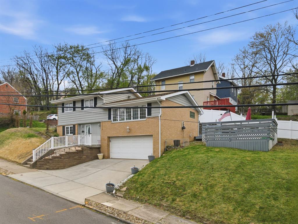 268 Plummer Avenue Pittsburgh, PA 15202 - Photo 3 of 50 a view of a house with a yard and sitting area