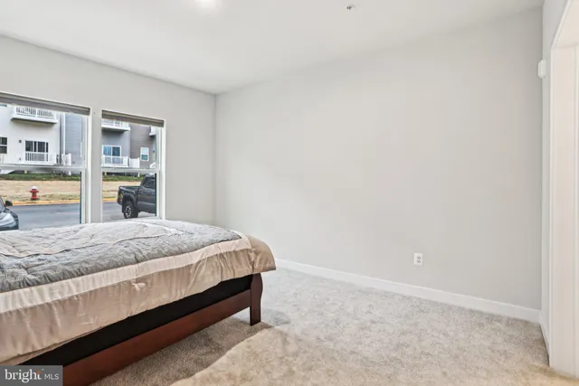 a bedroom with a bed and lamp