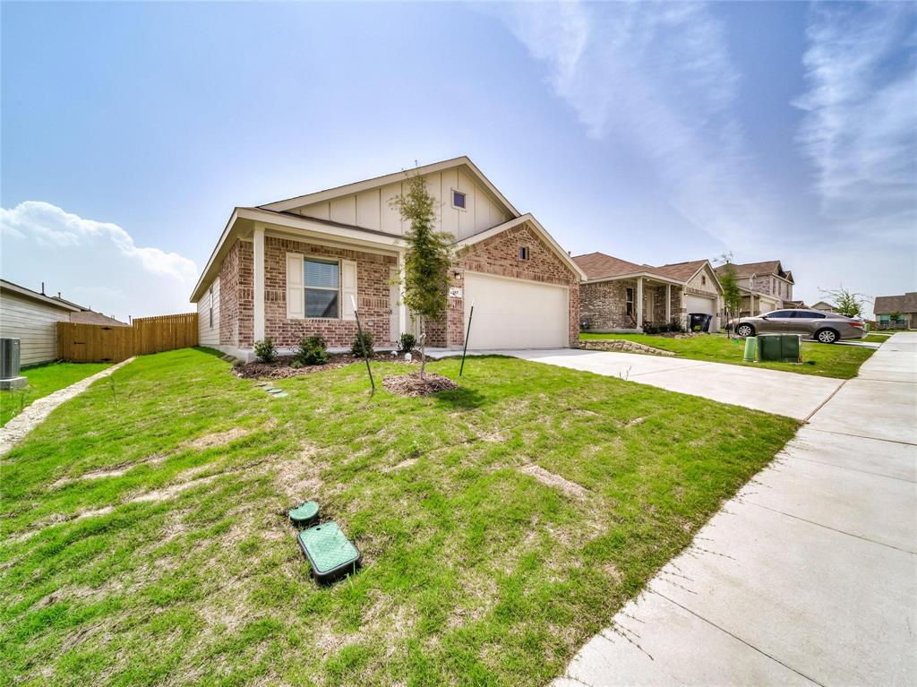 357 Sun Bluff Road Fort Worth, TX 76052 - Photo 5 of 35 Brick facade home featuring a two-car garage, concrete driveway, and a front porch entryway