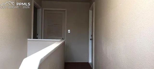a kitchen with a sink a refrigerator and cabinets