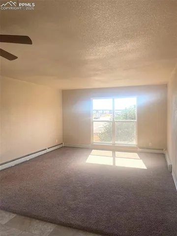 an empty room with a empty space and windows