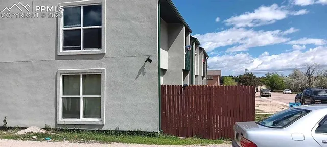 a front view of a house with many windows
