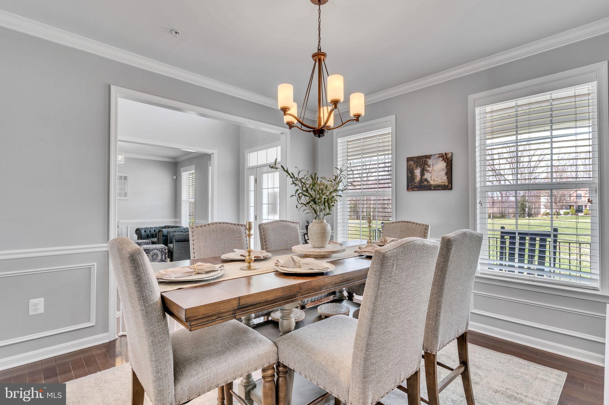 1935 Lowery Road Huntingtown, MD 20639 - Photo 11 of 65 a dining room with furniture a chandelier and wooden floor