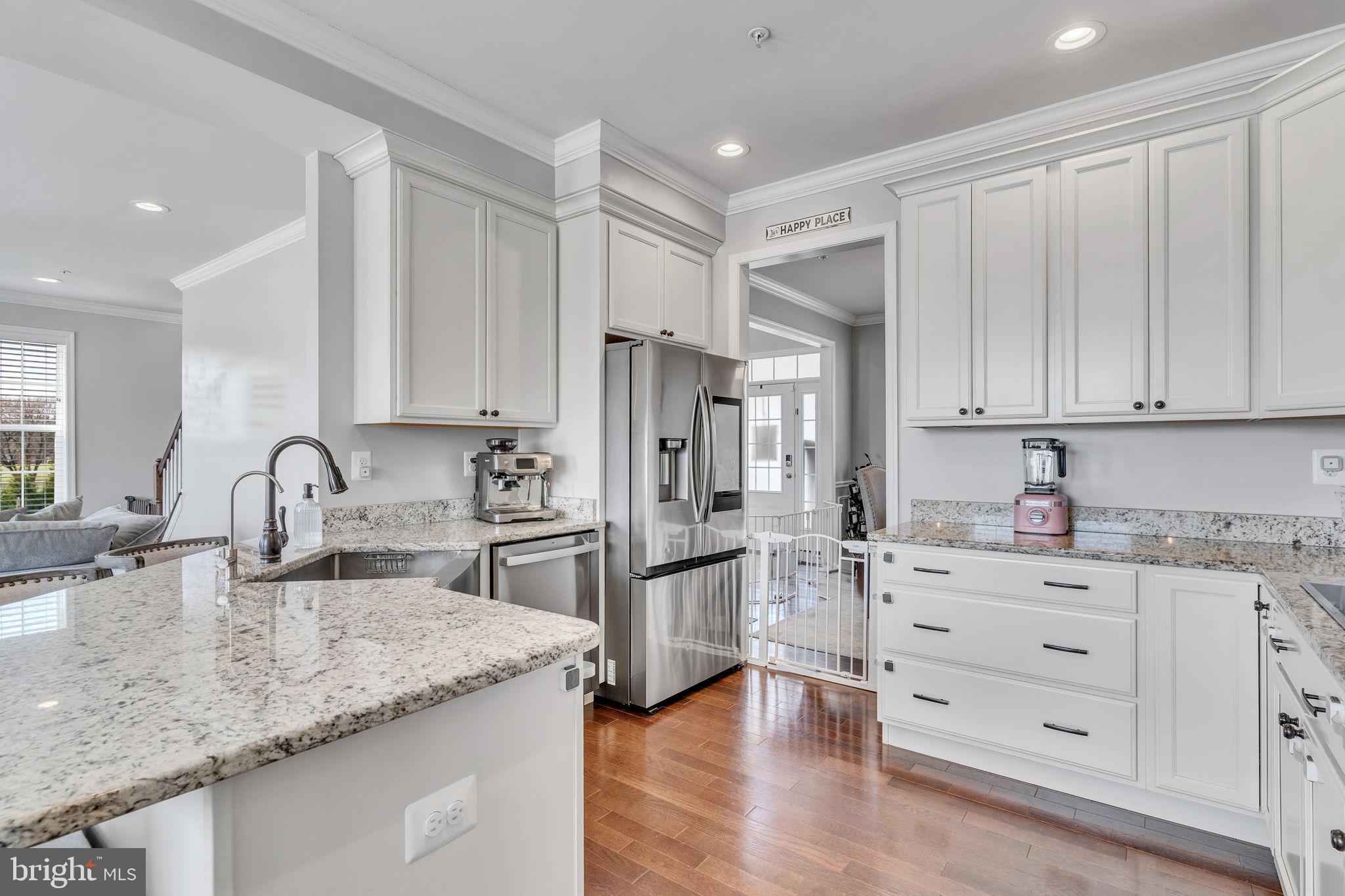 1935 Lowery Road Huntingtown, MD 20639 - Photo 14 of 65 a kitchen with stainless steel appliances granite countertop a refrigerator sink and cabinets