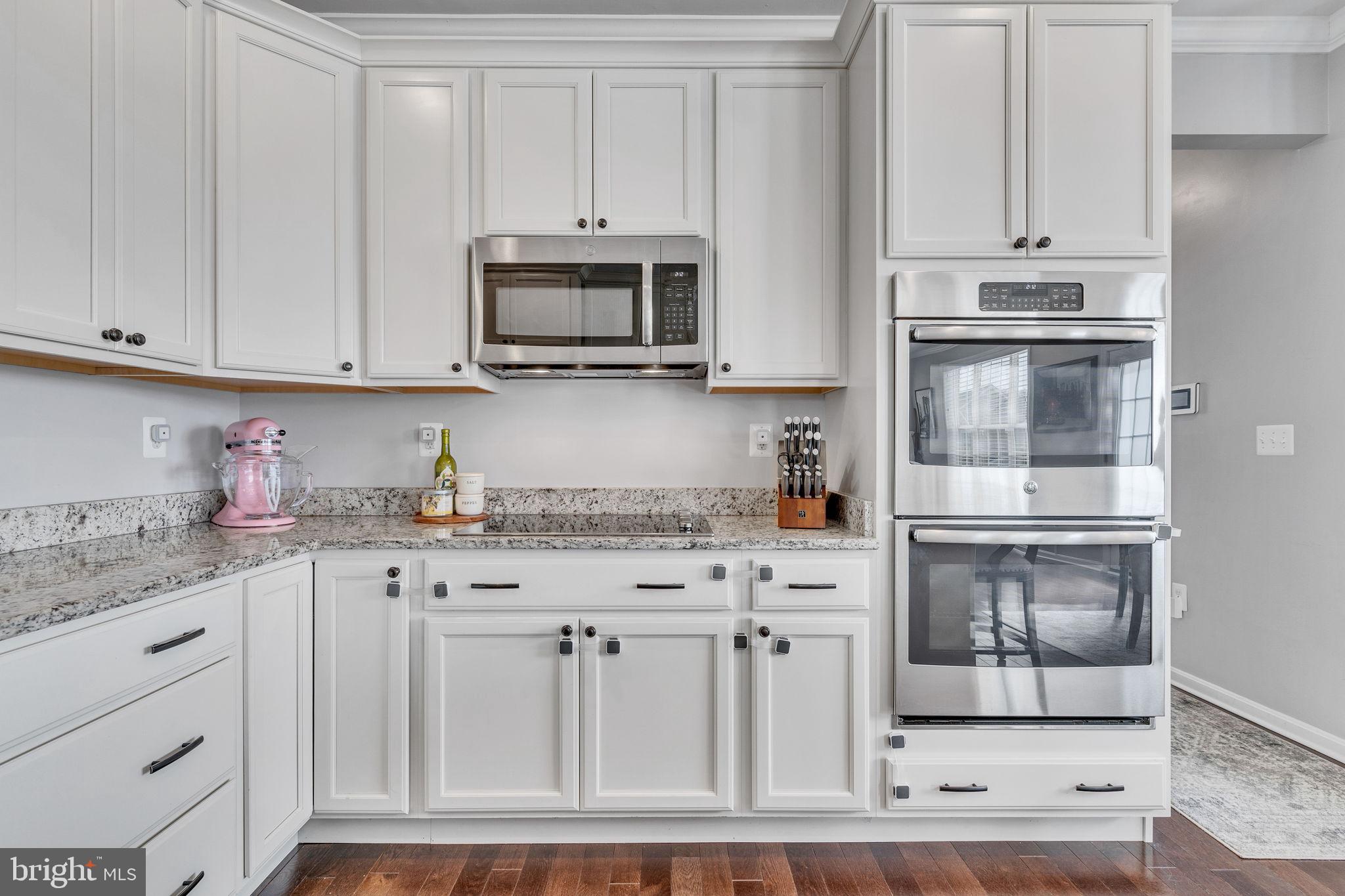 1935 Lowery Road Huntingtown, MD 20639 - Photo 16 of 65 a kitchen with granite countertop white cabinets and stainless steel appliances