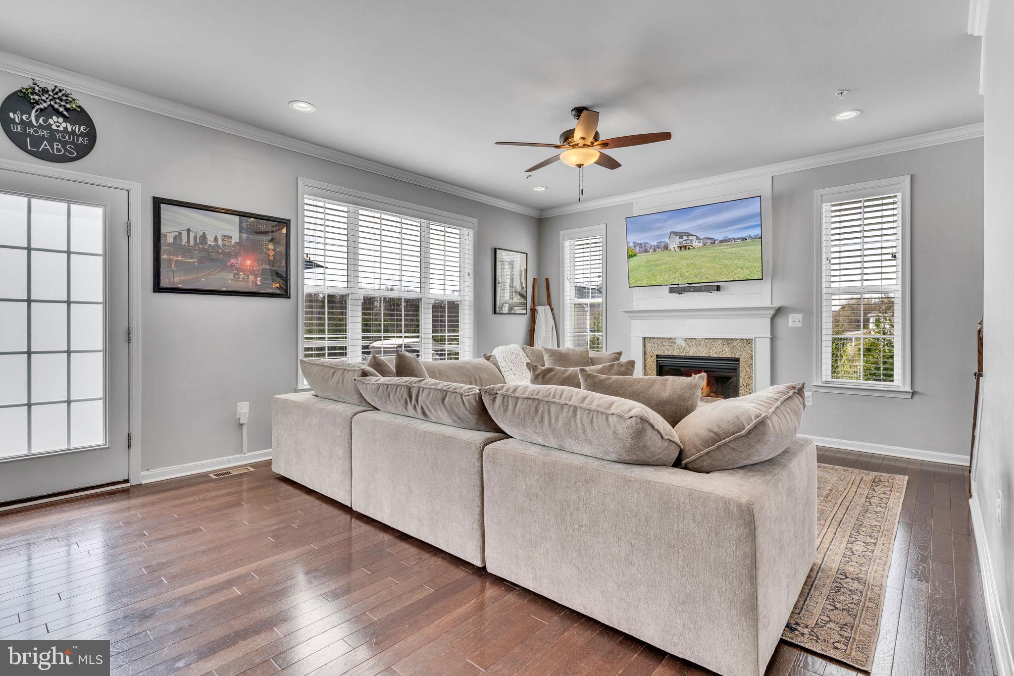 1935 Lowery Road Huntingtown, MD 20639 - Photo 26 of 65 a living room with furniture and a fireplace