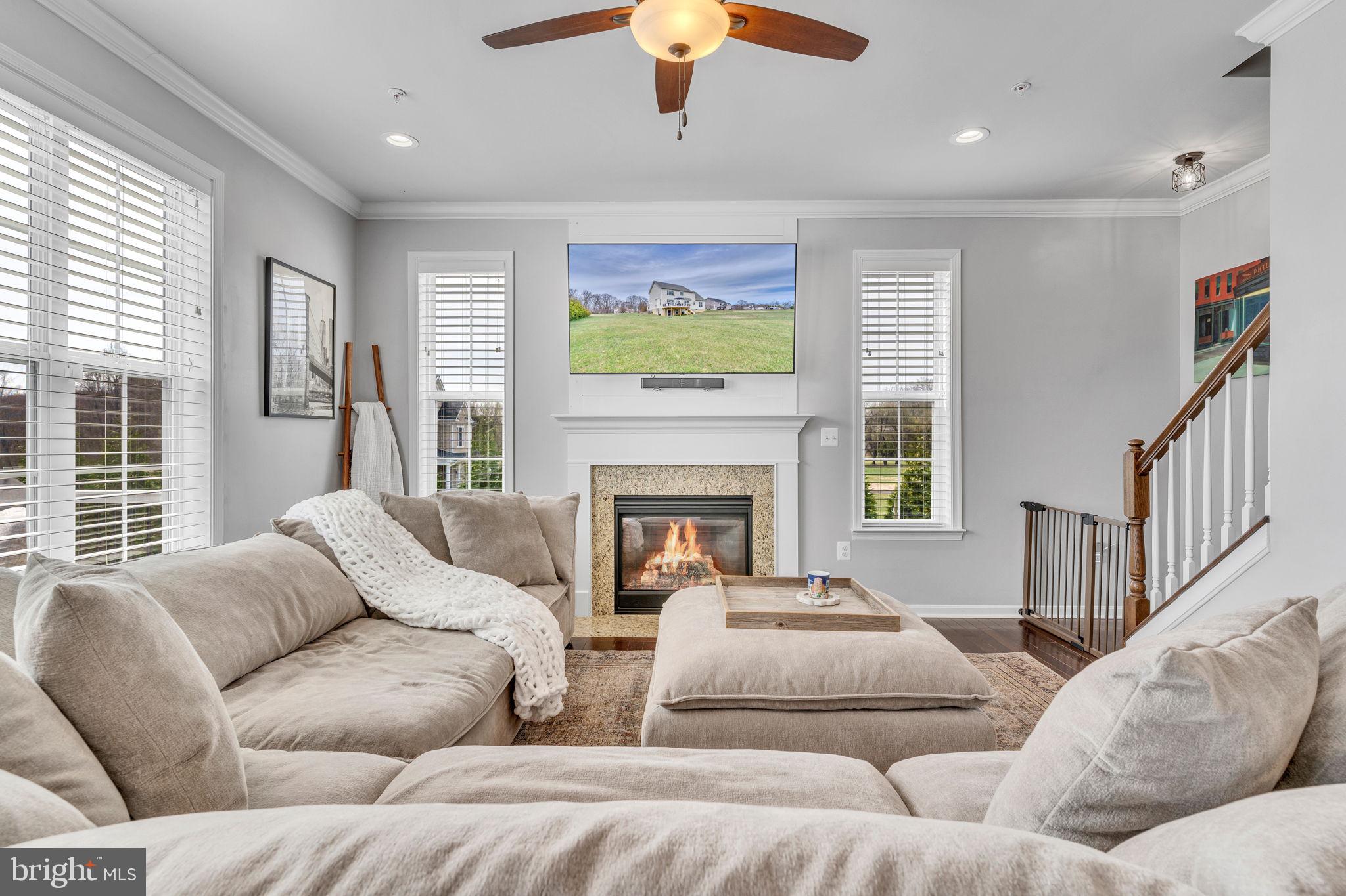1935 Lowery Road Huntingtown, MD 20639 - Photo 27 of 65 a living room with furniture fireplace and a large window