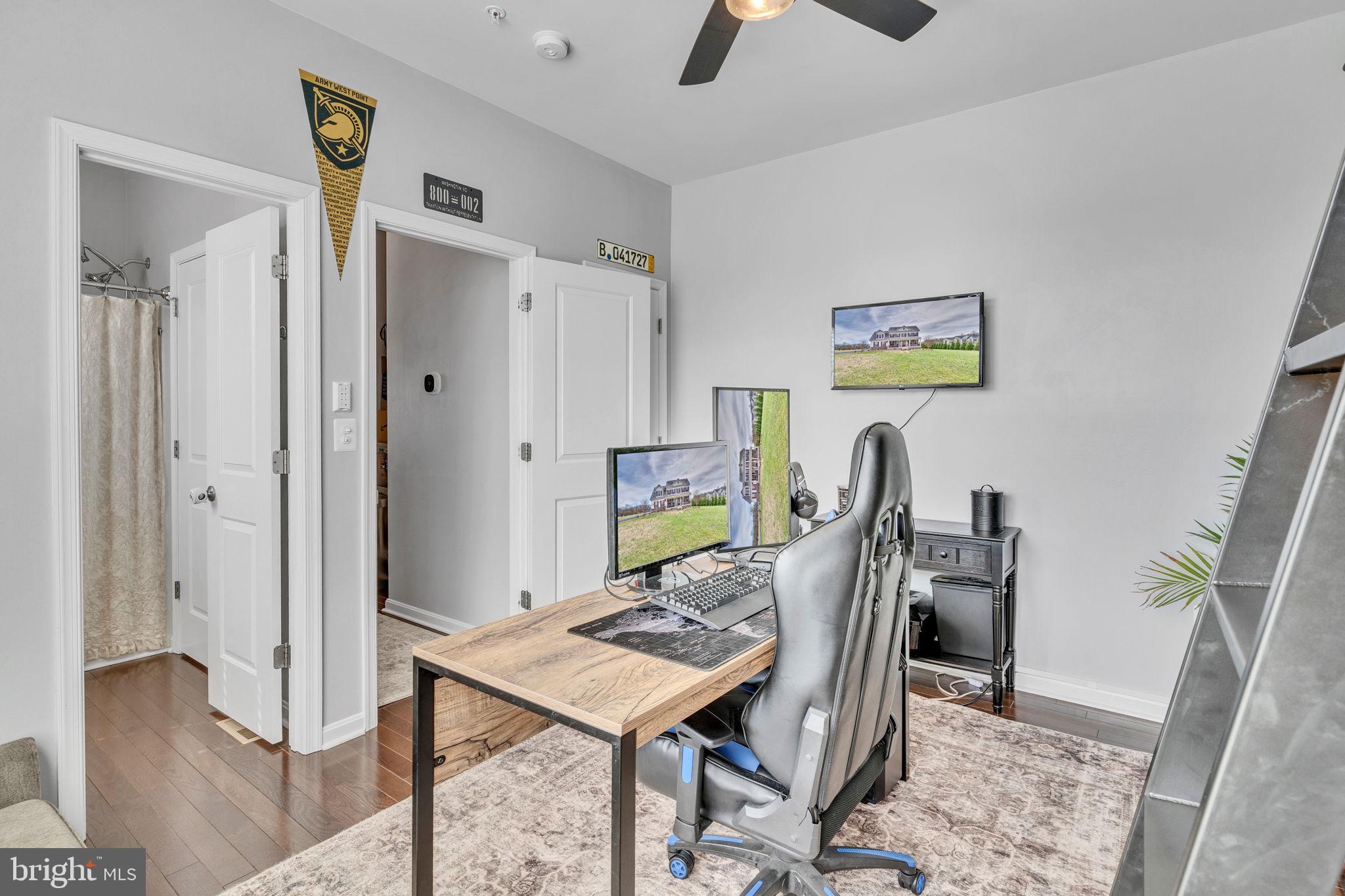 1935 Lowery Road Huntingtown, MD 20639 - Photo 33 of 65 a view of a workspace with furniture and wooden floor