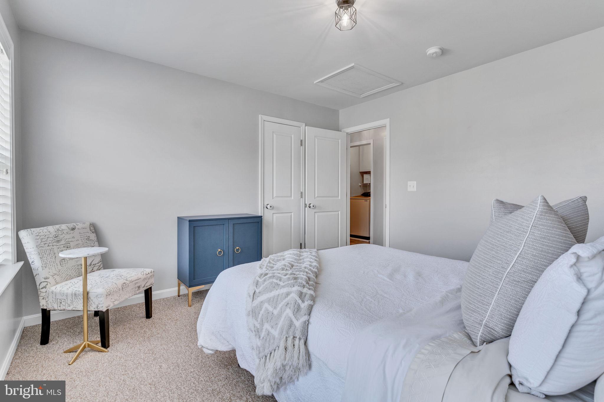 1935 Lowery Road Huntingtown, MD 20639 - Photo 40 of 65 a bedroom with a bed and a chair